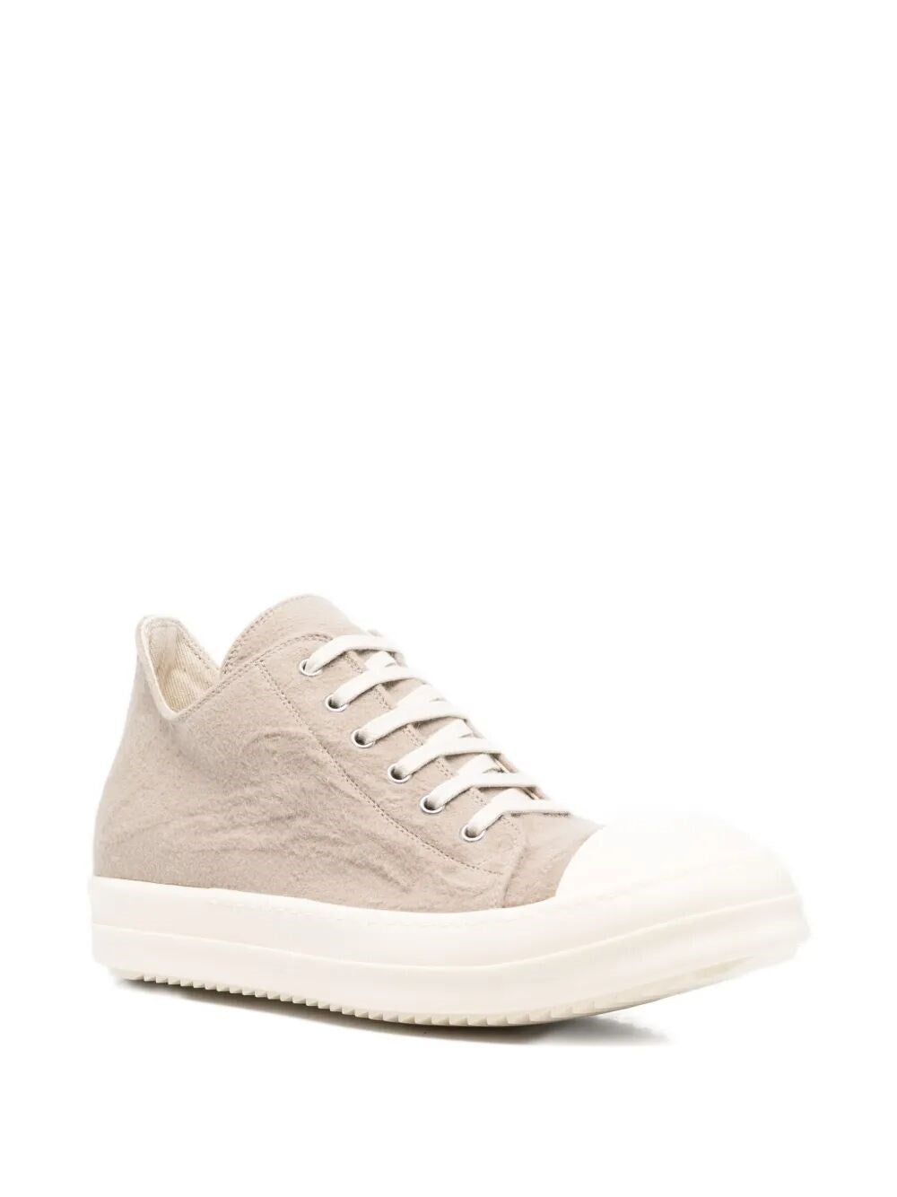 Beige sneaker with white sole on a white background