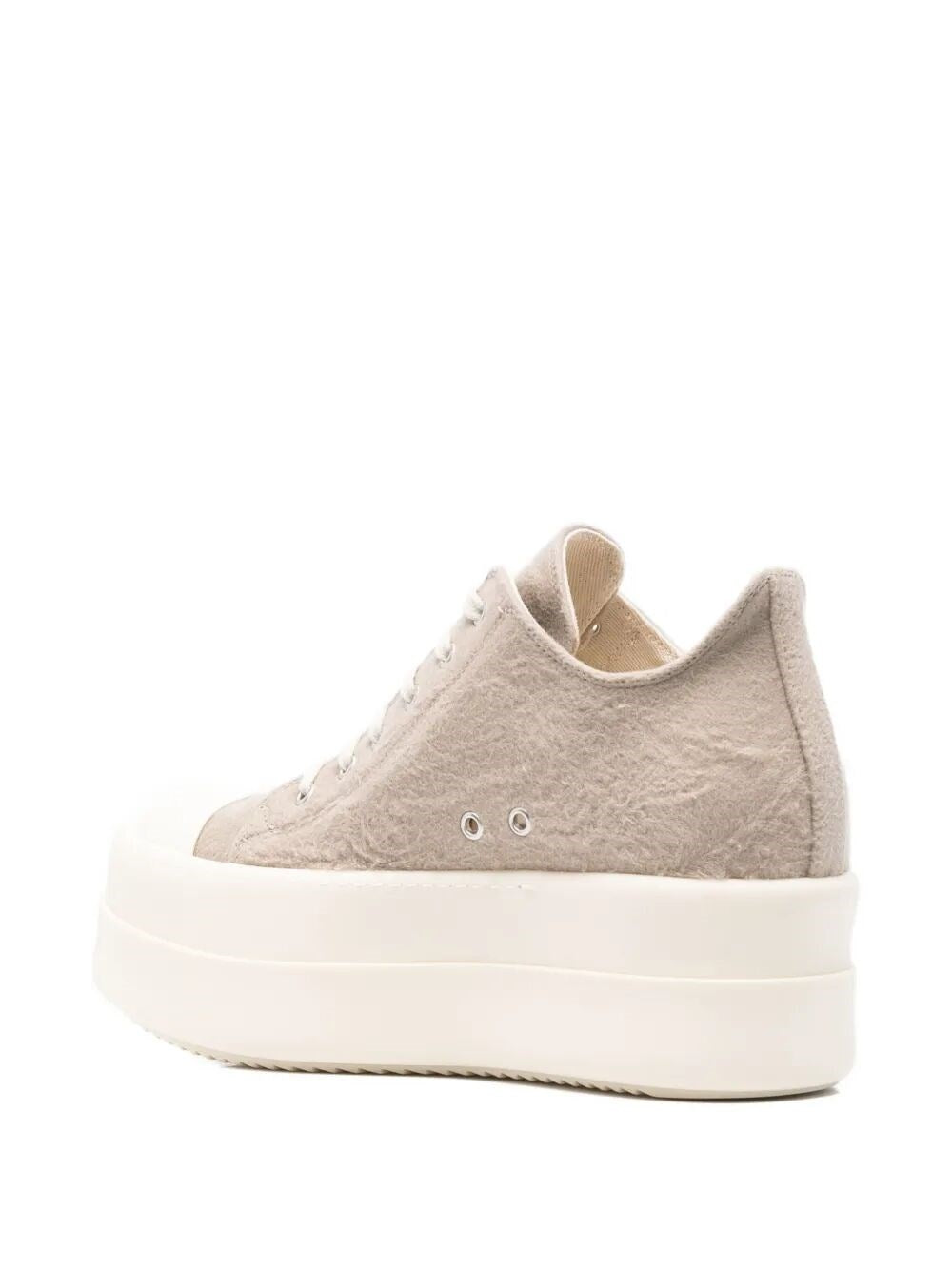 Beige sneaker with a white sole on a white background