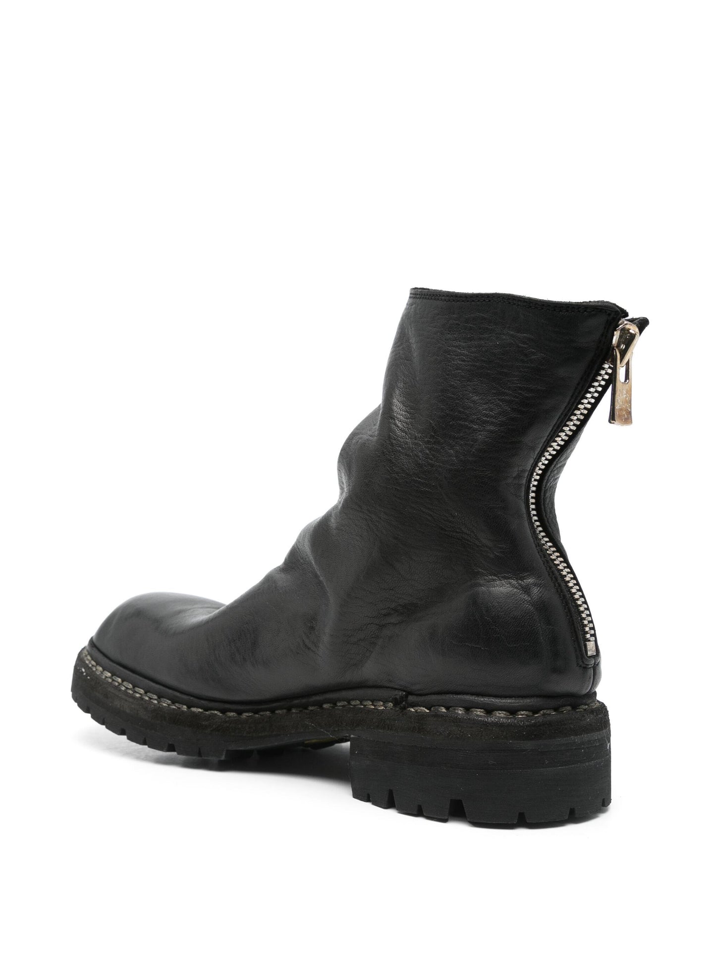 Black leather boot with a zipper on a white background