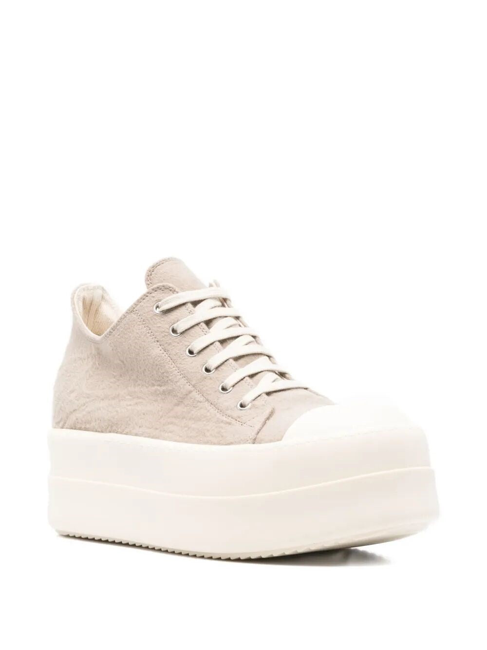 White sneaker with a platform sole on a white background