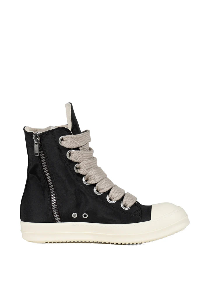 Black high-top sneaker with white sole on a white background