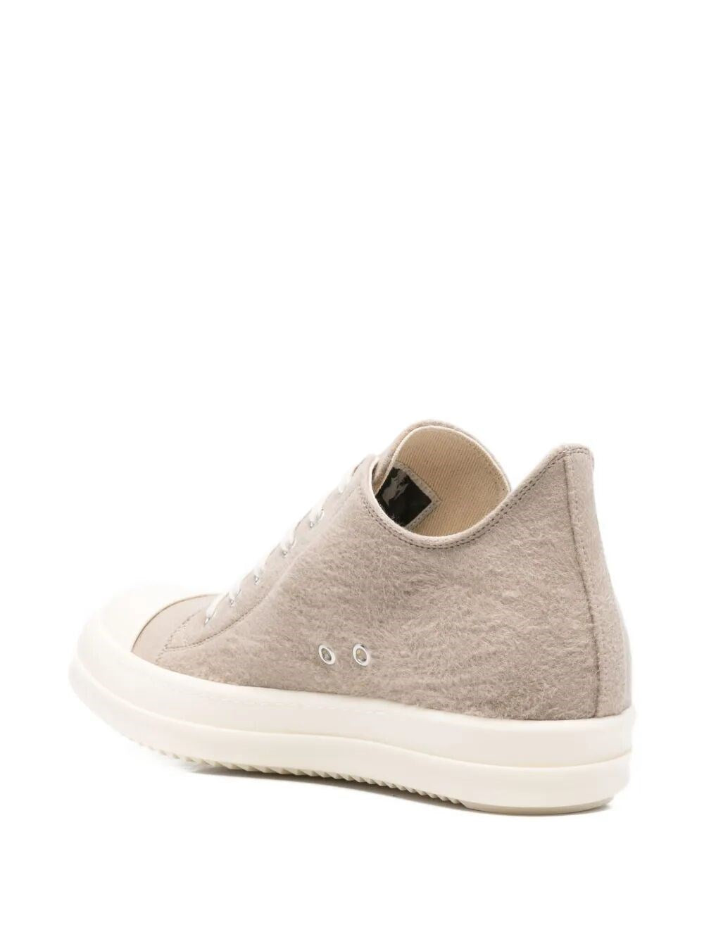 Gray sneaker with white sole on a white background