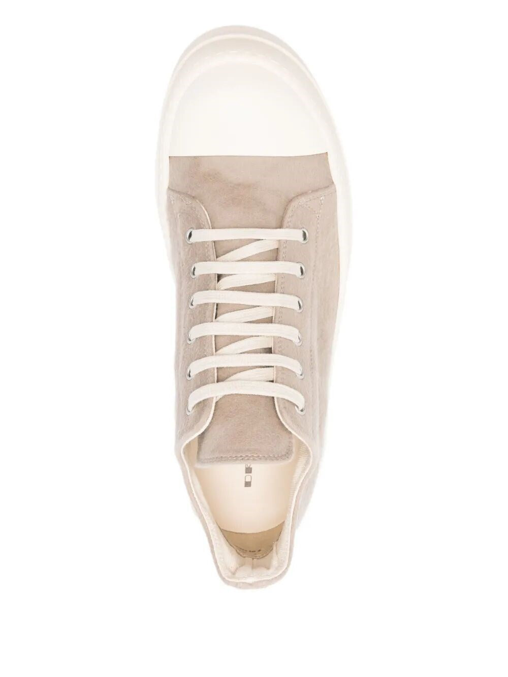 Beige sneaker with white laces on a white background
