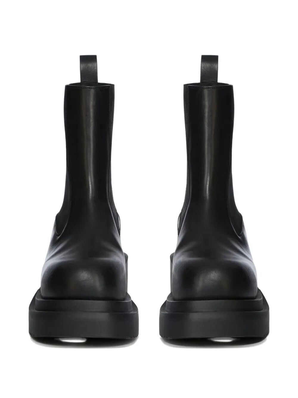 Pair of black leather boots on a white background