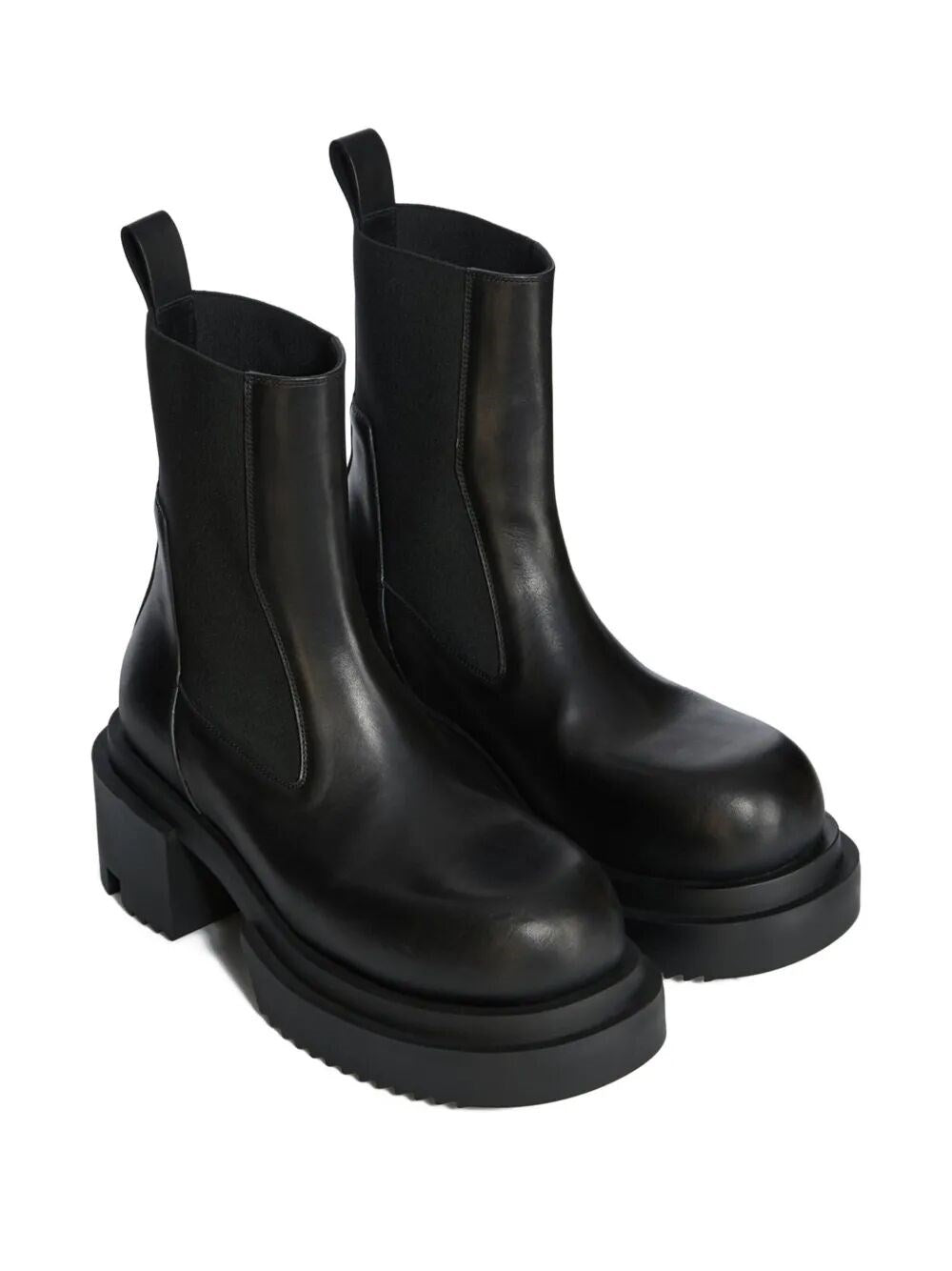 Pair of black leather boots on a white background