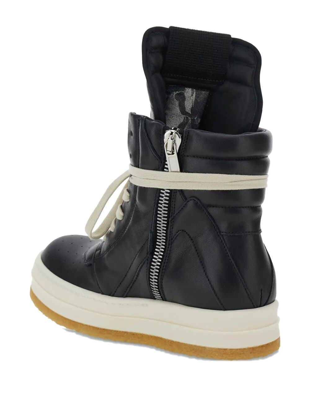 Black winter boot with a white sole on a white background