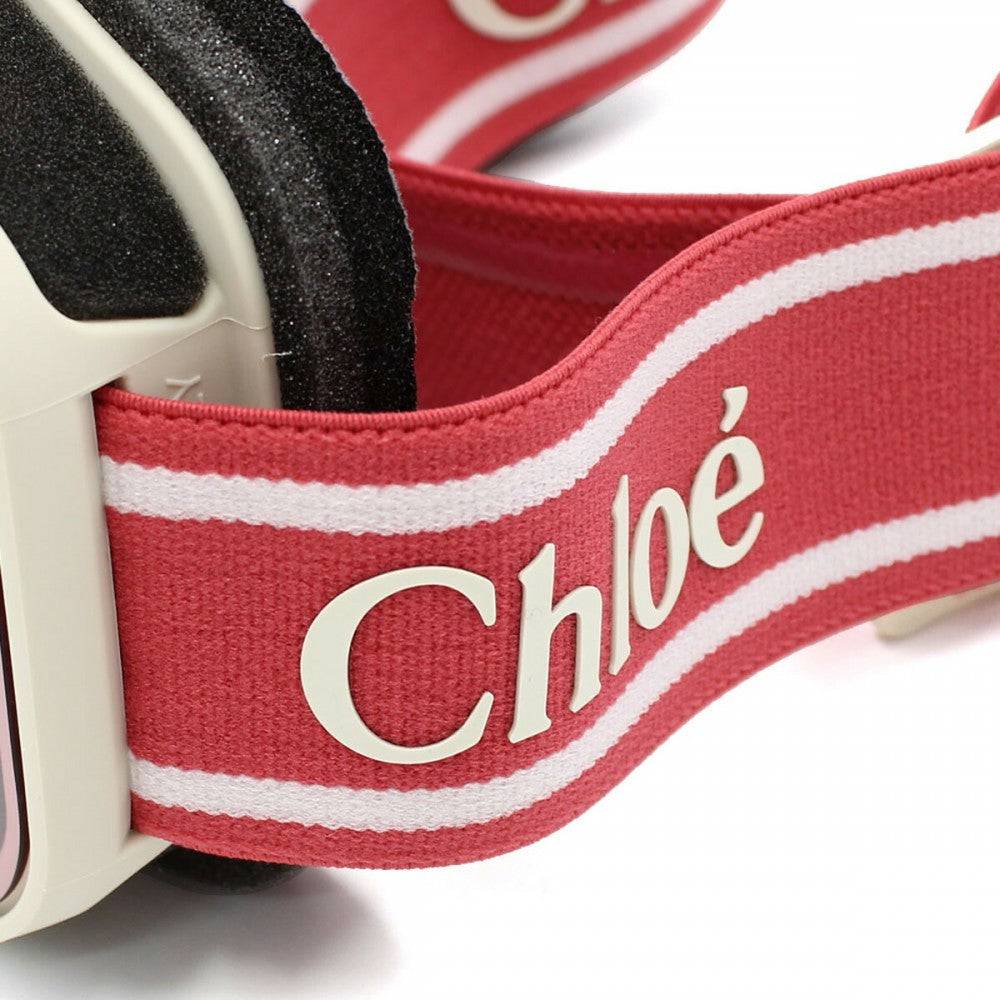 Close-up of a red belt with 'Chloe' branding on a white background