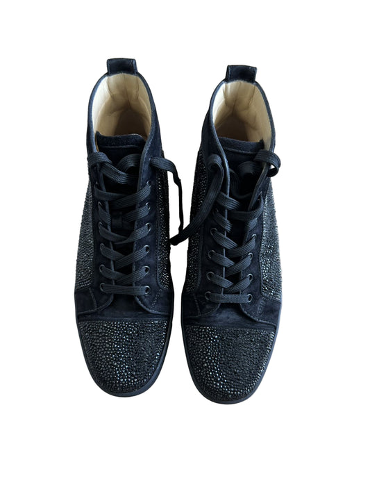 Pair of black high-top sneakers with rhinestone embellishments on a light wooden floor.