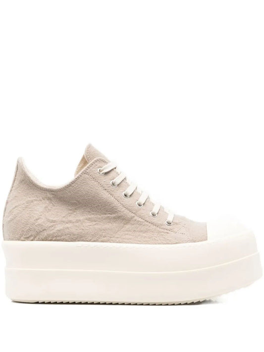 Beige sneaker with white sole on a white background