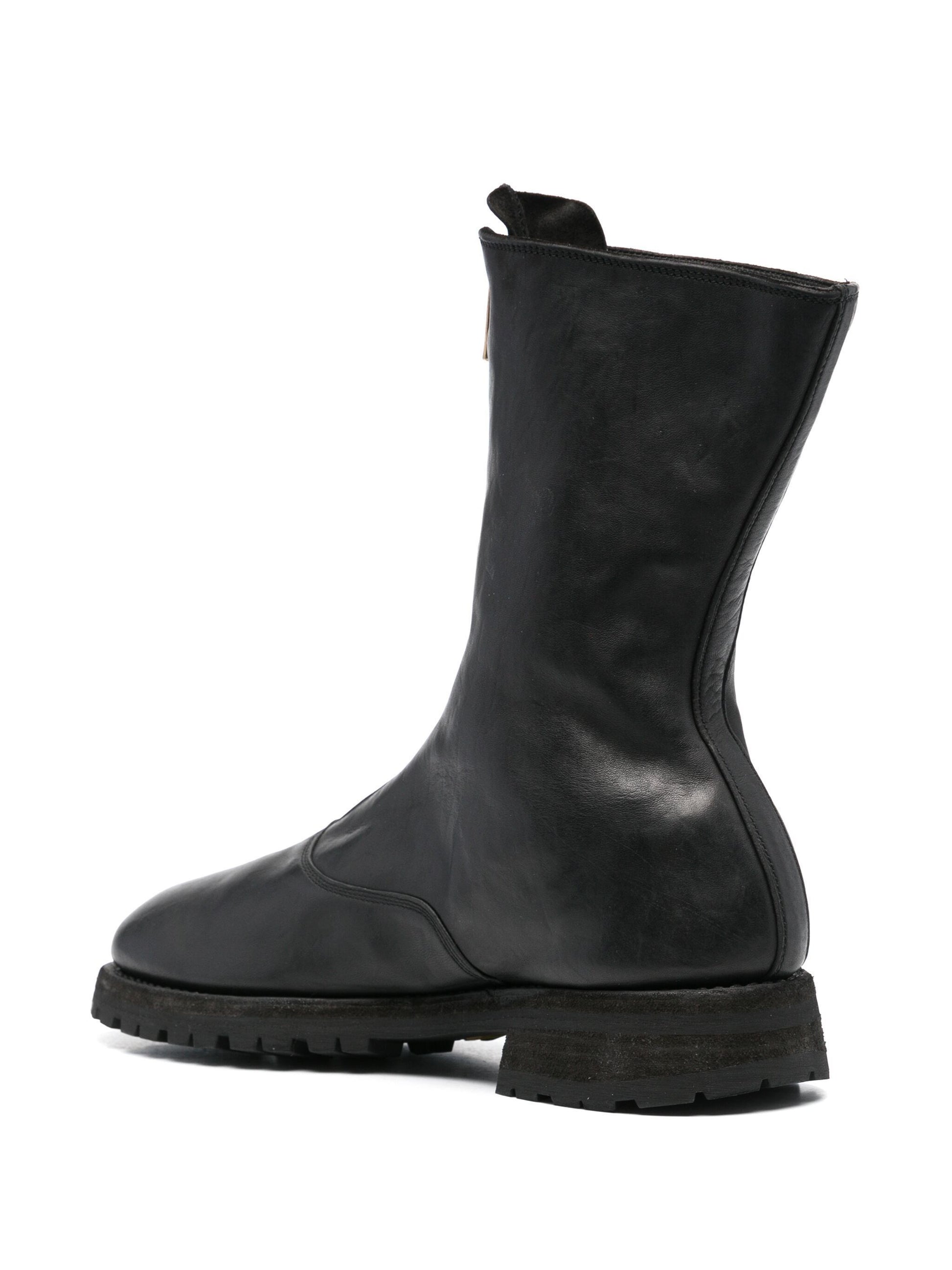 Black leather boot on a white background
