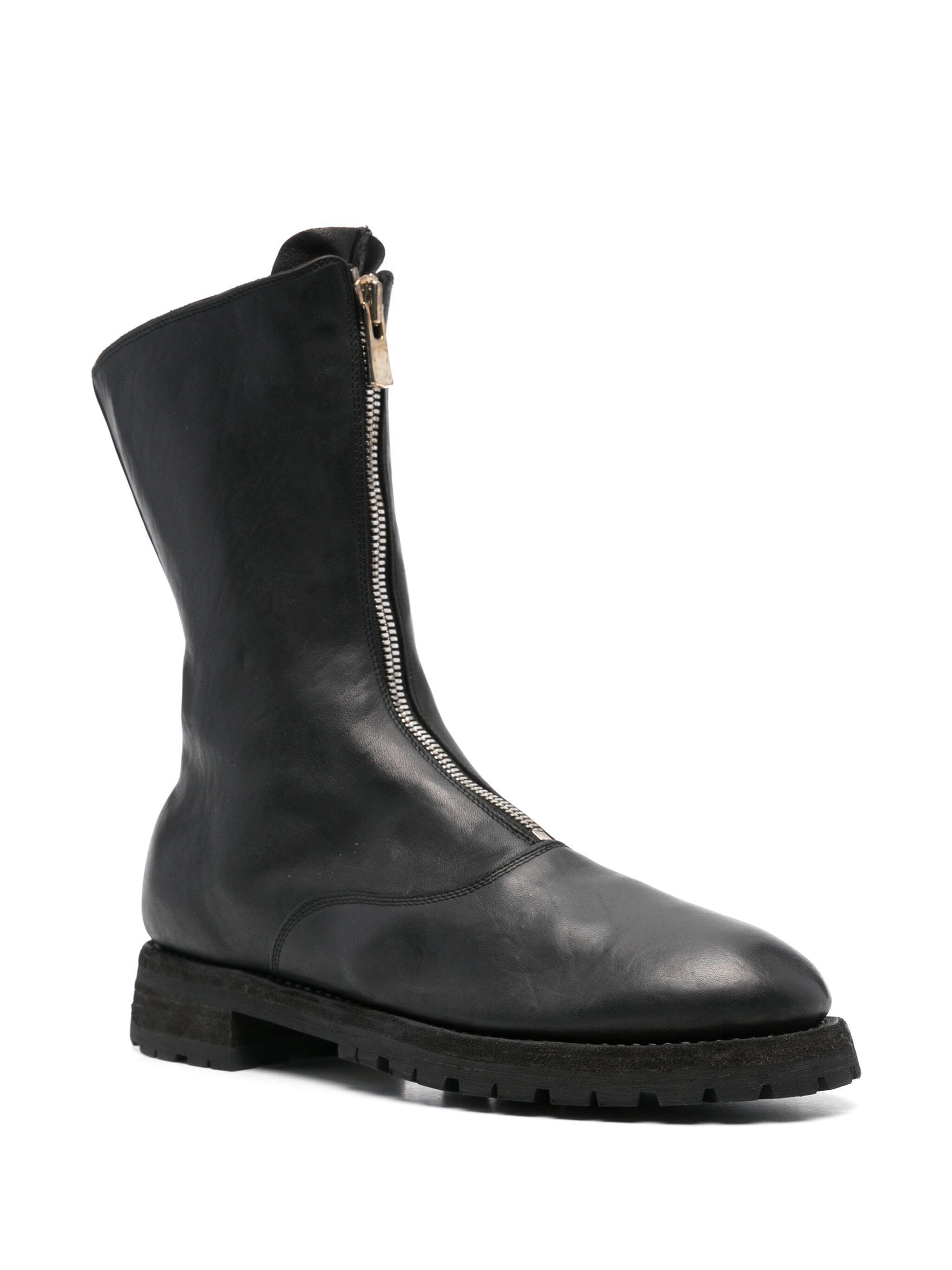 Black leather boot with a zipper on a white background