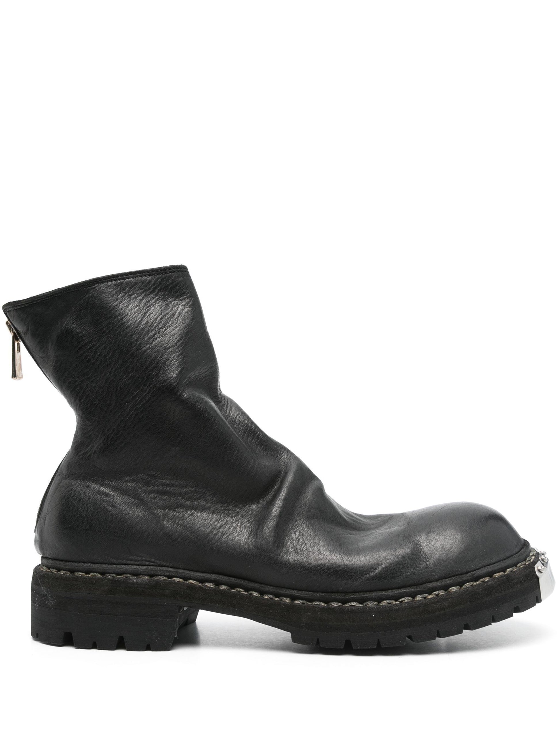 Black leather boot on a white background