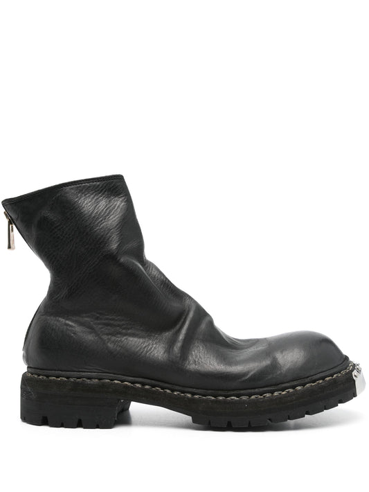 Black leather boot on a white background