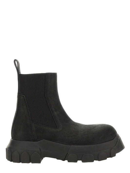 Black Chelsea boot on a white background